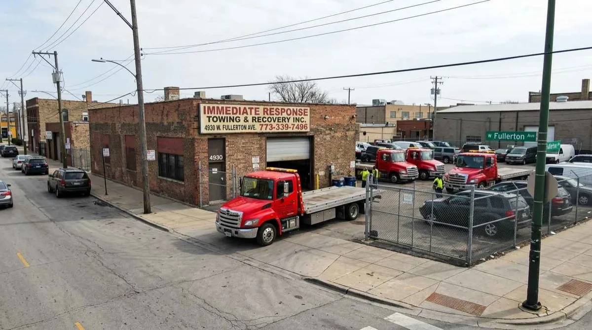Immediate Response Towing Chicago office and trucks at 4930 W Fullerton Ave