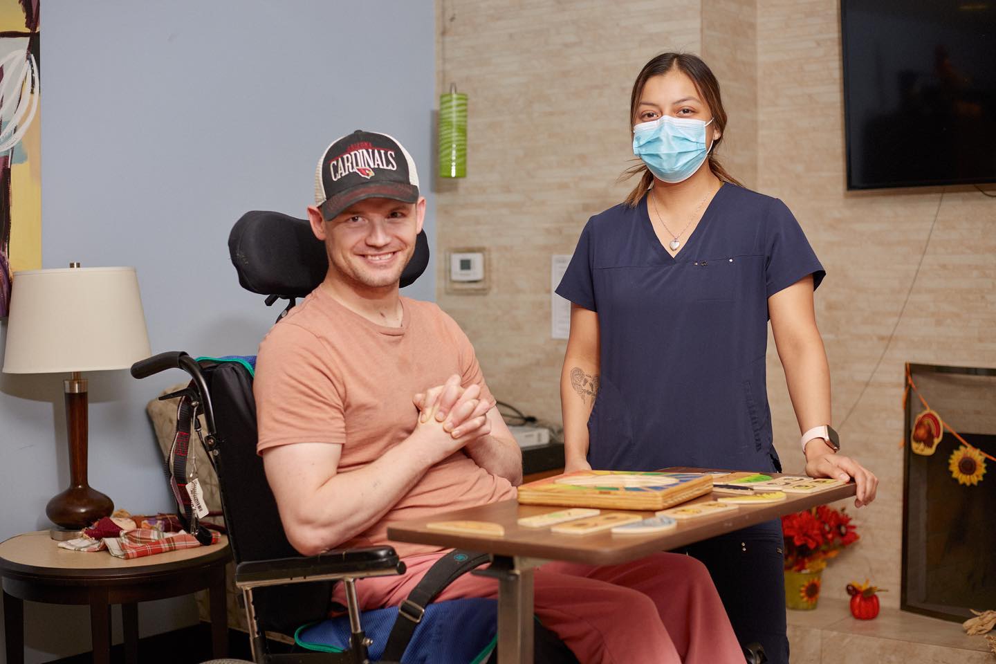 Staged testimonial film still of a small clinic owner speaking on camera, medium shot with office backdrop blurred, warm studio key light, natural expression, branded elements subtly visible, conveys trust and patient-focused results in healthcare storytelling.