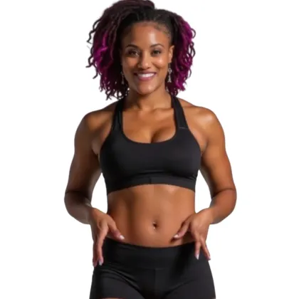 A confident woman in her early 40s, mid-workout, smiling and stretching in a sunlit, modern home gym.