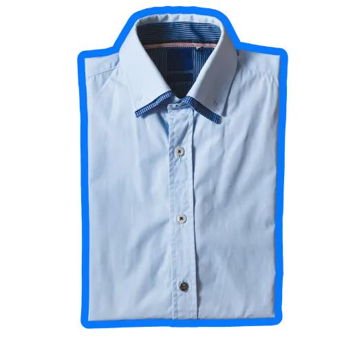 Freshly dry-cleaned and pressed blue dress shirt, neatly folded to demonstrate the professional results of dry cleaning services at Prime Laundry - Ocala, highlighting the distinction between dry cleaning and couture care.