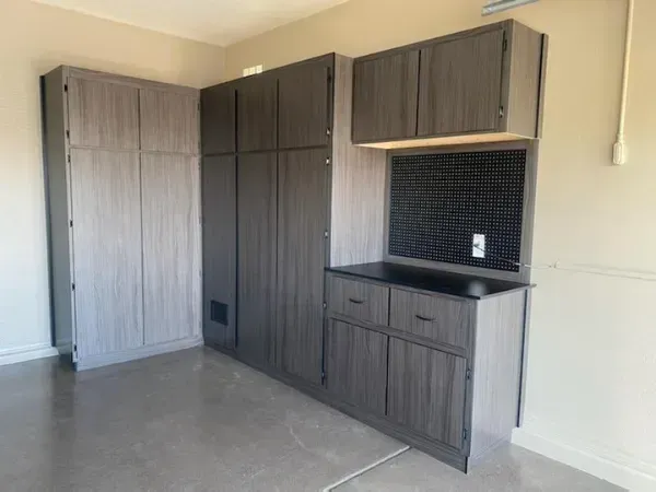 Freshly completed epoxy garage floor coating with a smooth, durable finish inside a clean two-car garage.