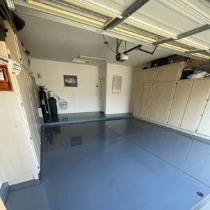 glossy dark gray or blue-gray epoxy floor