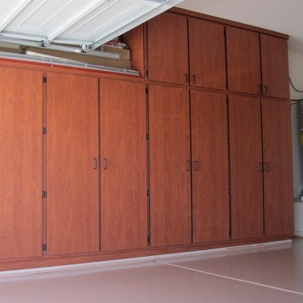 warm-toned, wood-grain garage cabinets