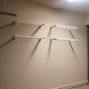 four white wire shelves