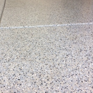 view of an epoxy garage floor