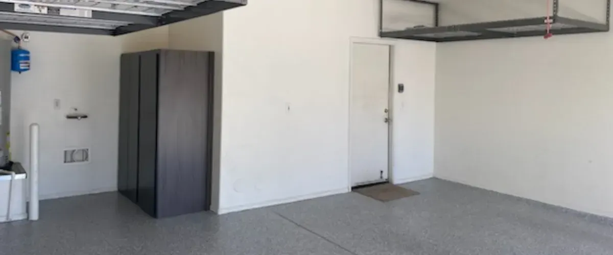 Compact dark wood cabinet placed in modern epoxy garage