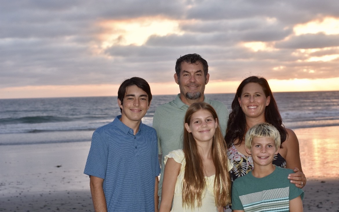 Bedroom with two windows and a cozy bed.
