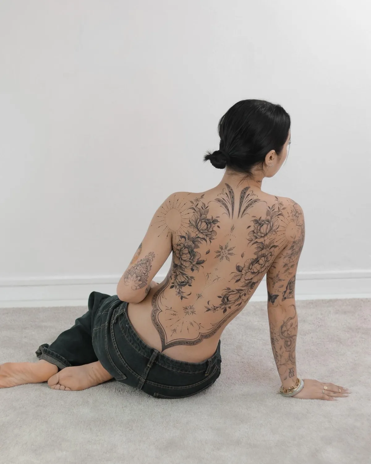 person with tattoo on right arm