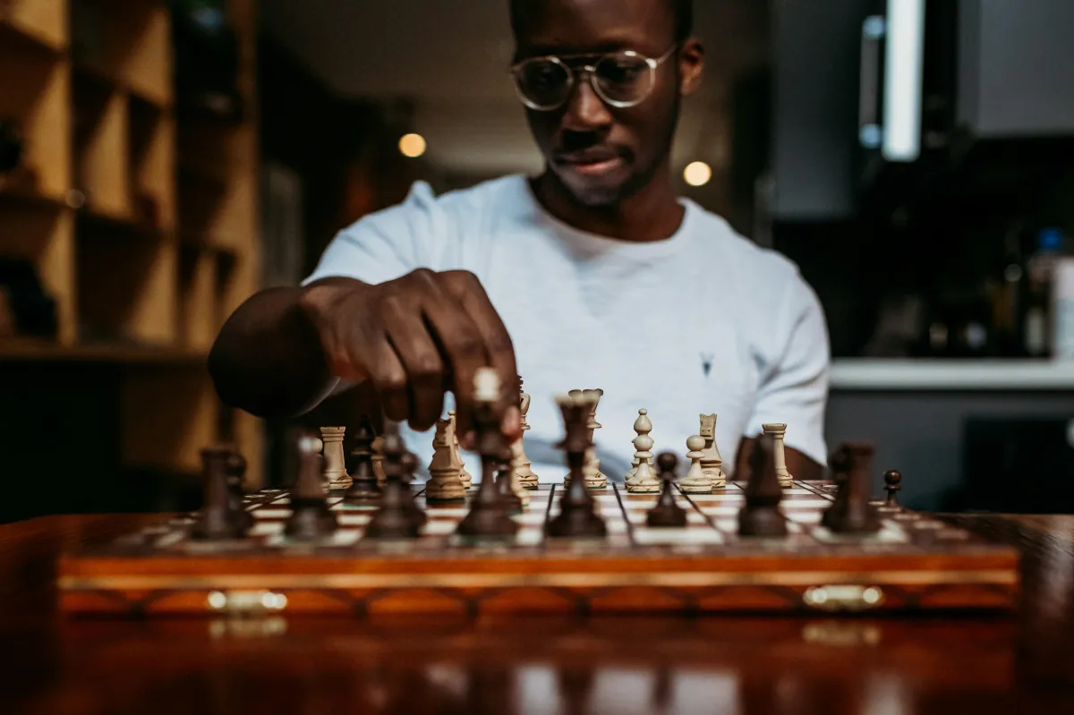 picture of a chess player moving a piece