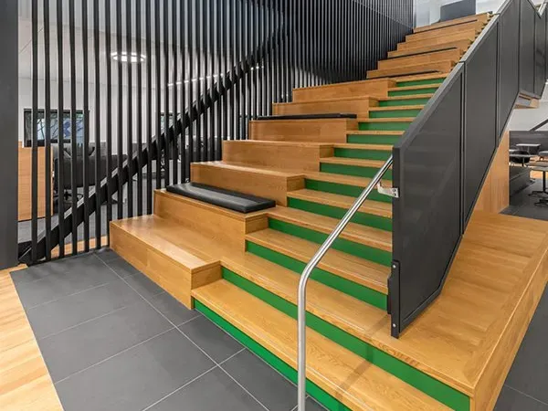 How Designers Use Monumental Stairs to Anchor Commercial Interiors