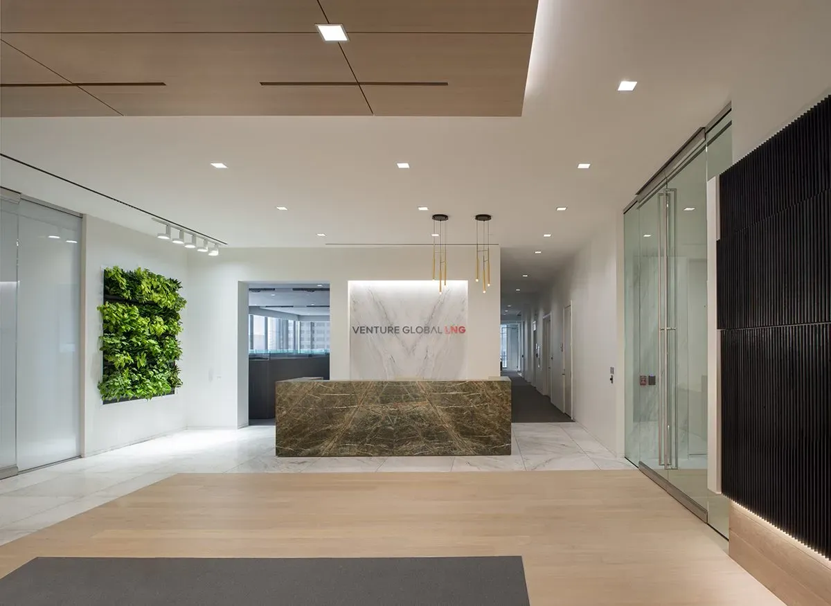 A corporate office reception desk built using custom shop finished European Oak flooring