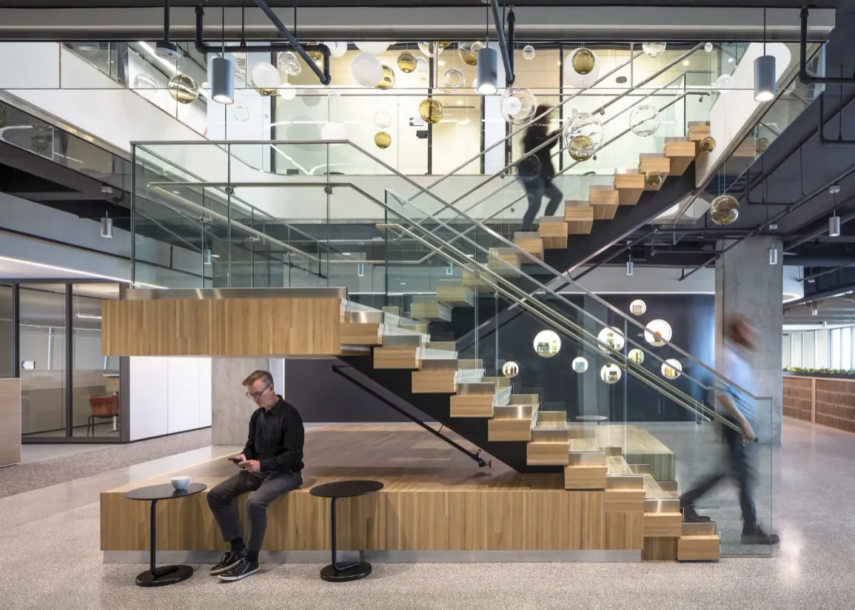 This photo showcases an office design with custom wood stair treads and risers