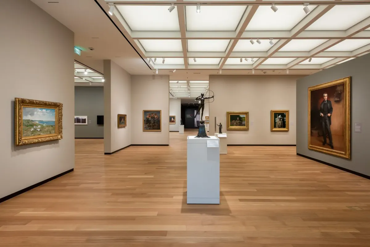 The image shows rift sawn white oak flooring being used in a museum that's filled with paintings.