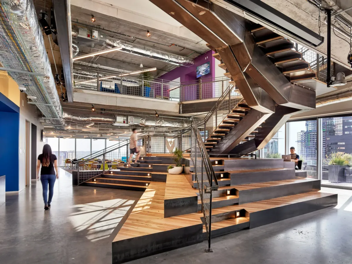 This photo shows monumental stairs in the middle of an office lobby
