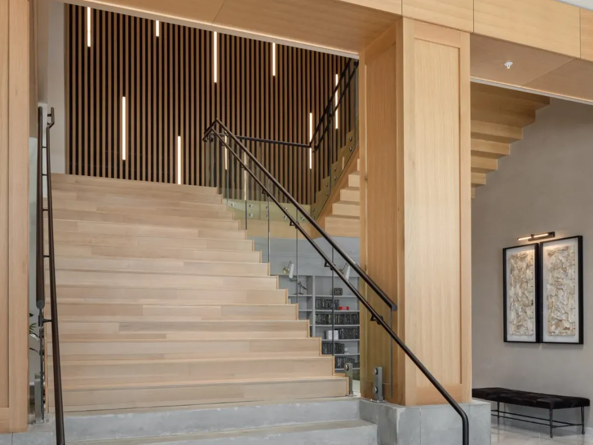 The image prominently shows luxury stairs that uses real wood. It's a staircase used in Noun Boutique Hotel.