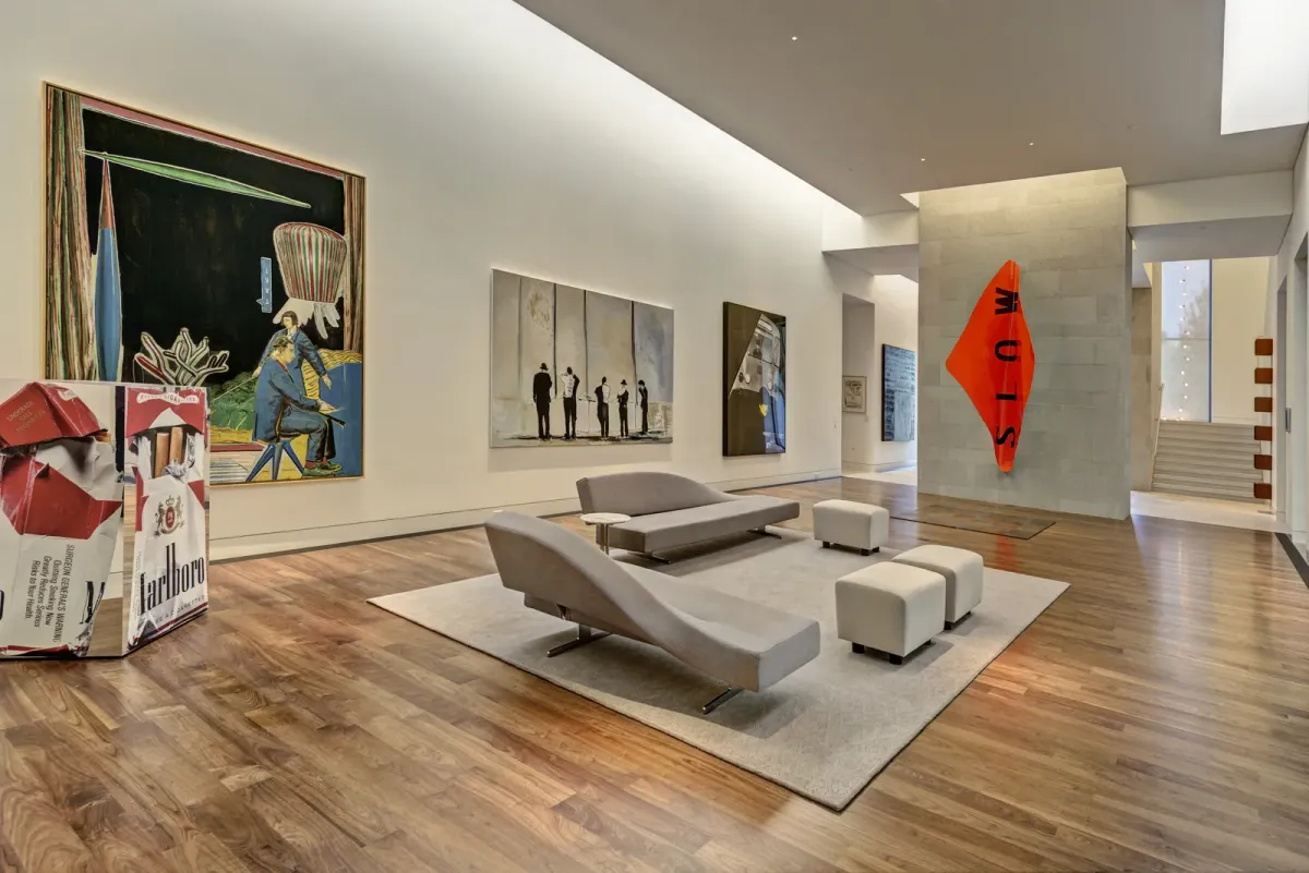 An image showing an interior with real wood flooring alongside some couches and a Marlboro prop.