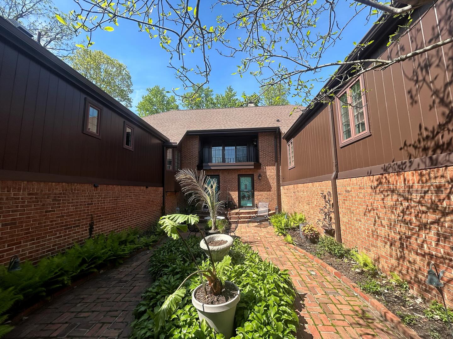 The roof of a building with a tree in the background