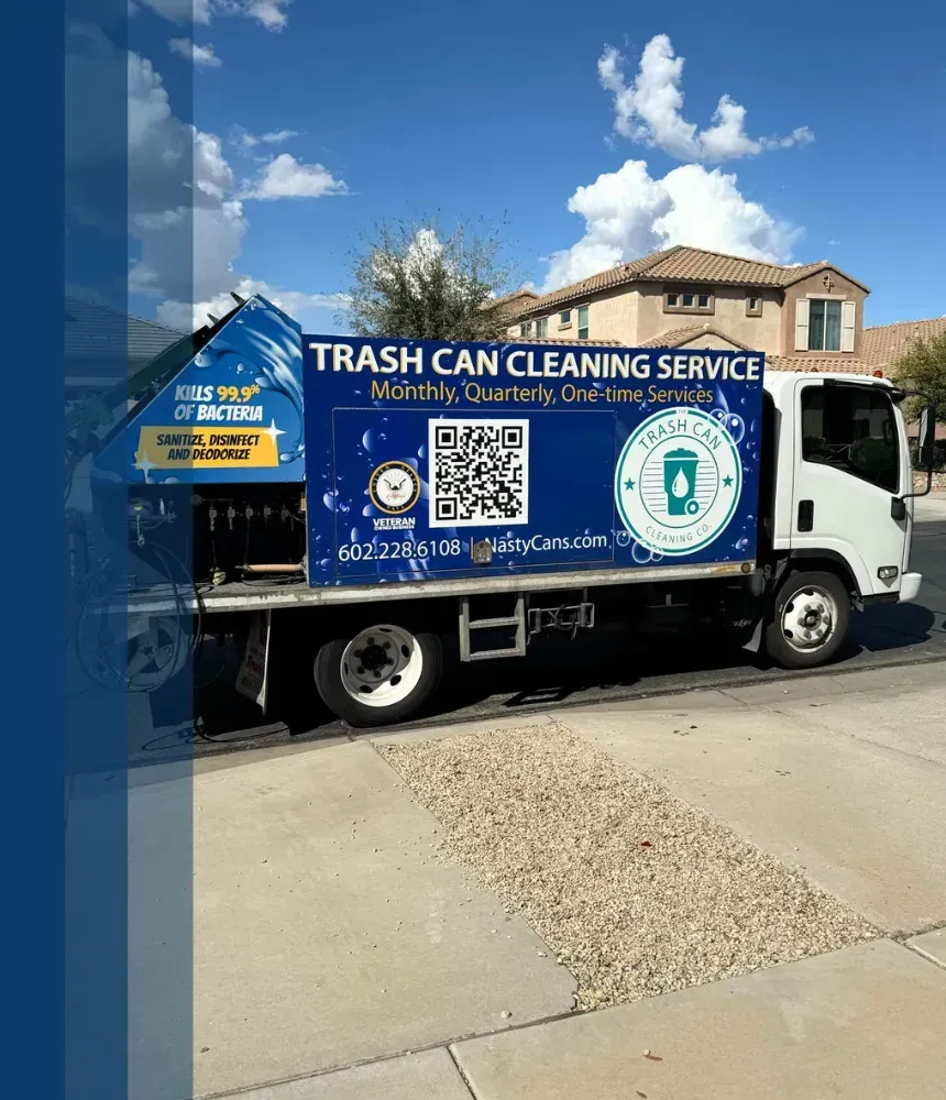 Trash bin cleaning truck with equipment for sanitizing, disinfecting, and deodorizing bins, parked in a residential area.