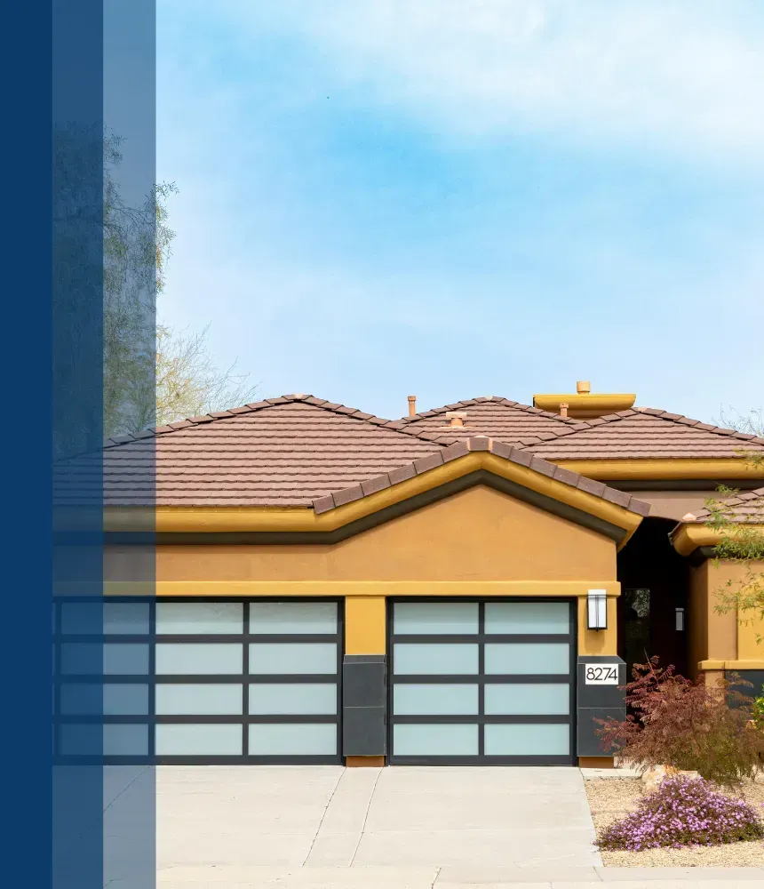 Modern home with frosted glass garage doors and a sleek, minimalist design.