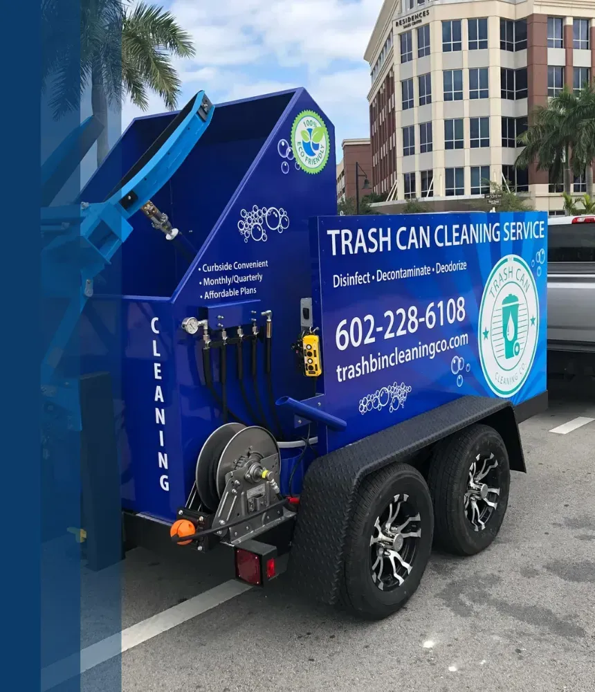 A blue trash can cleaning service truck with eco-friendly branding, promoting disinfecting, deodorizing, and decontaminating curbside trash cans.