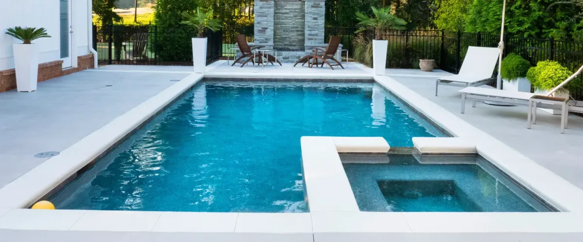 Luxury pool with modern chairs and a relaxing outdoor setting