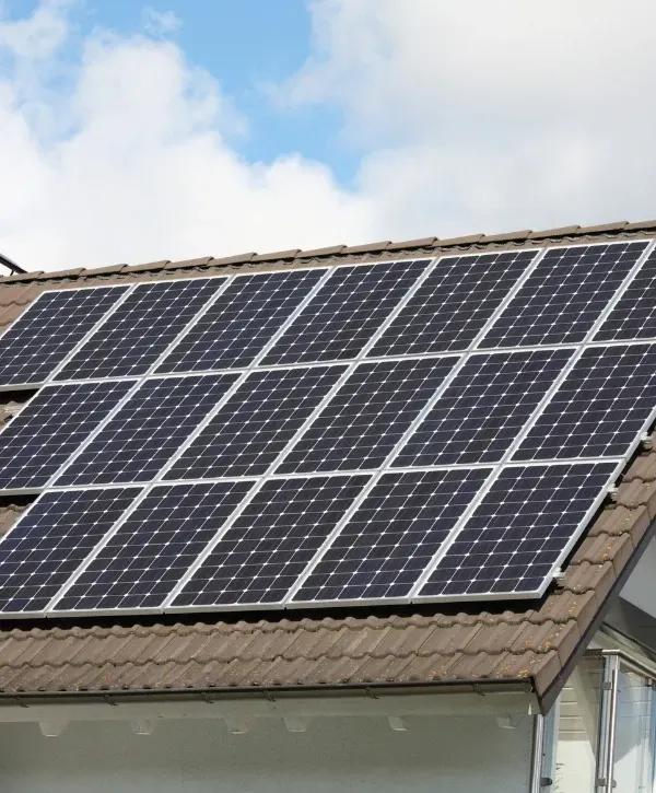 Clean solar panels on a tiled roof in Foothills Village AZ under bright sunlight.w of solar panel installation on a residential rooftop