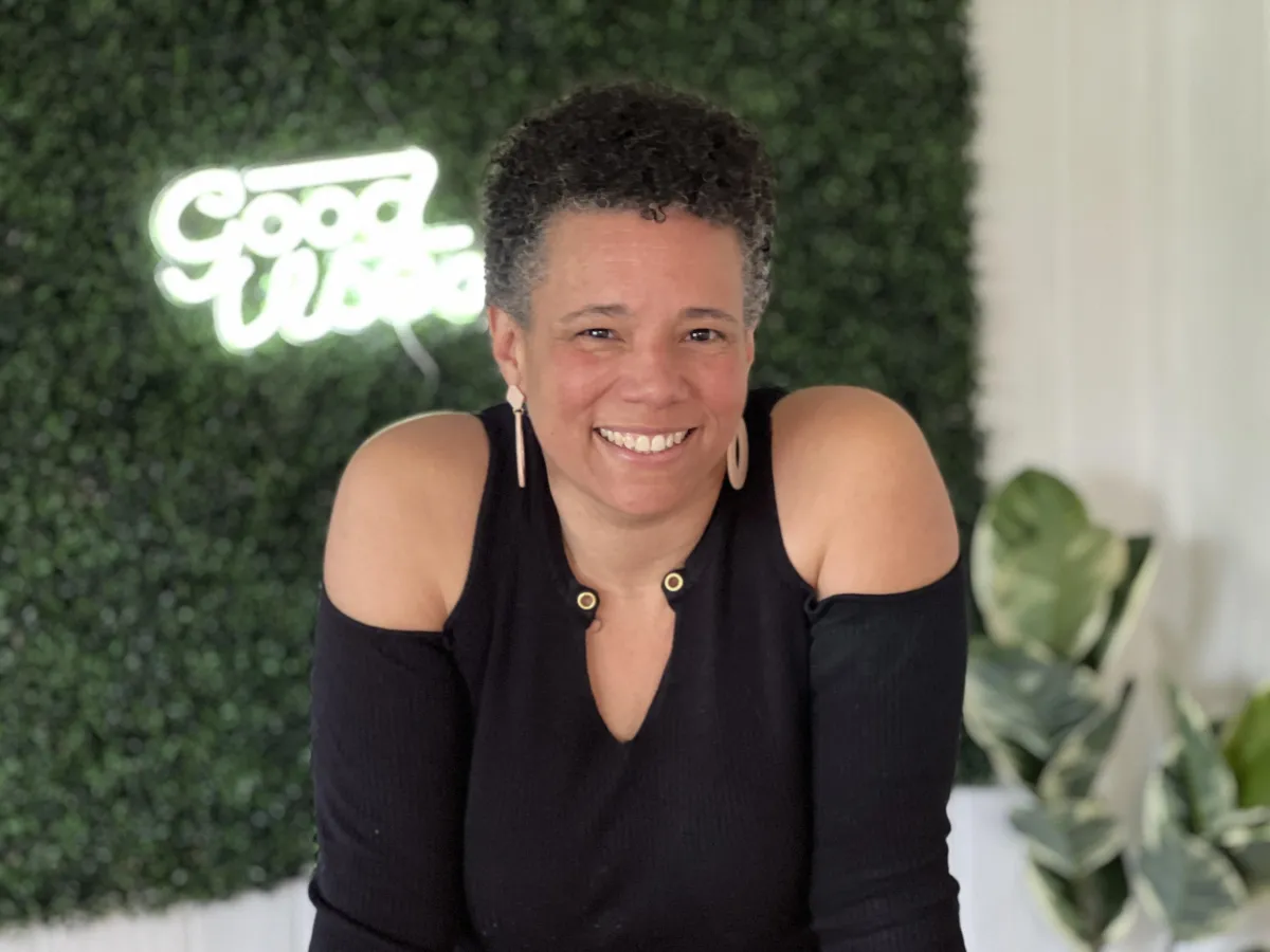 photo of arika clark with short hair and a black shirt