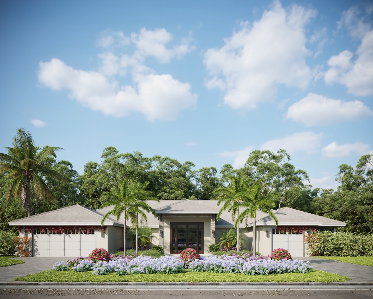One-story stucco home with tile roof and palm tree landscaping, representing a licensed Southwest Florida home builder