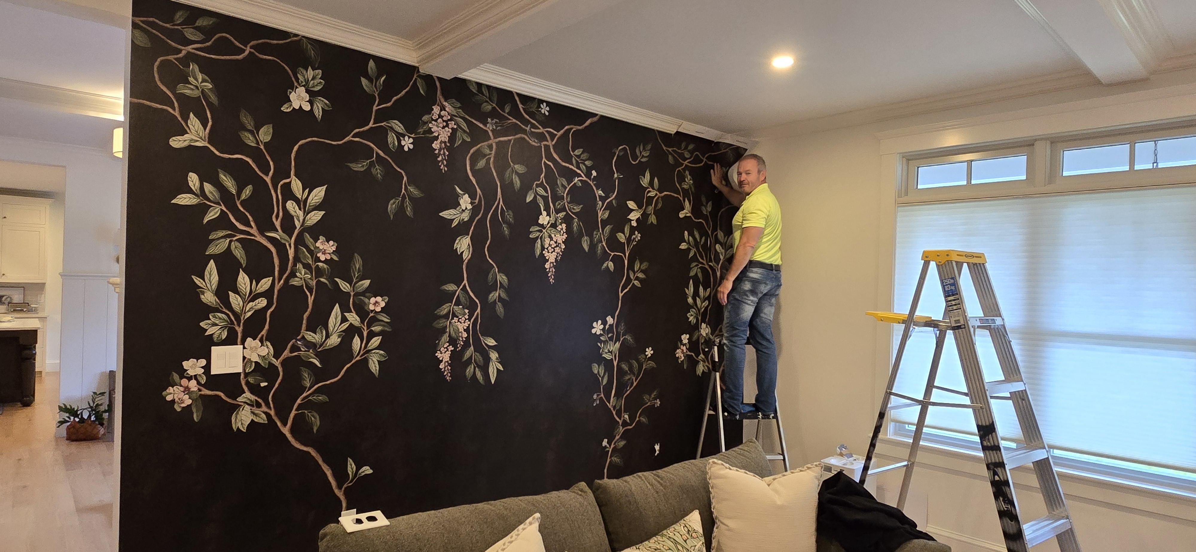 woman in black sweater holding white and black vr goggles