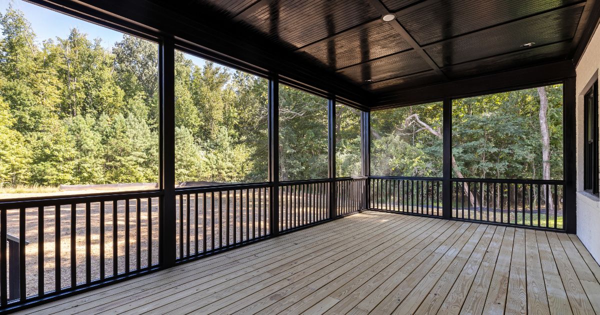 Custom covered patio with wood posts and an outdoor seating area at a Boise, Idaho home