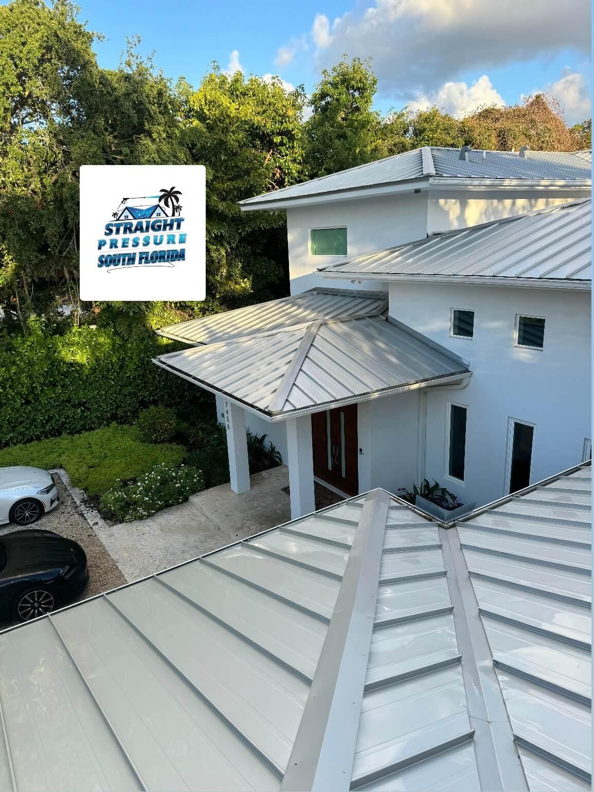 Modern white home with metal roof after residential pressure cleaning in Pinecrest FL