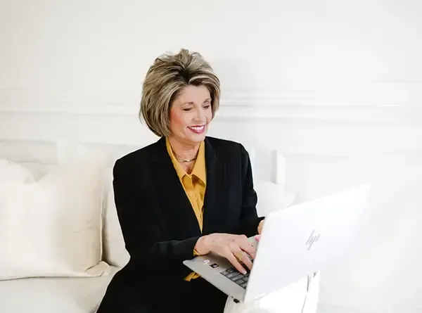 Tonya Gossage, founder of Gossage Consulting, working on strategic business solutions from her laptop.