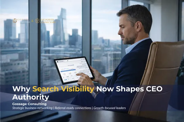 Male CEO reviewing search analytics and keyword performance on a tablet in a modern executive office overlooking a city skyline, representing leadership strategy, digital credibility, and search visibility in business consulting.