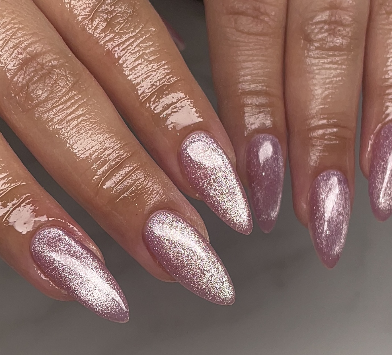 Chrome icy blue manicure with reflective finish