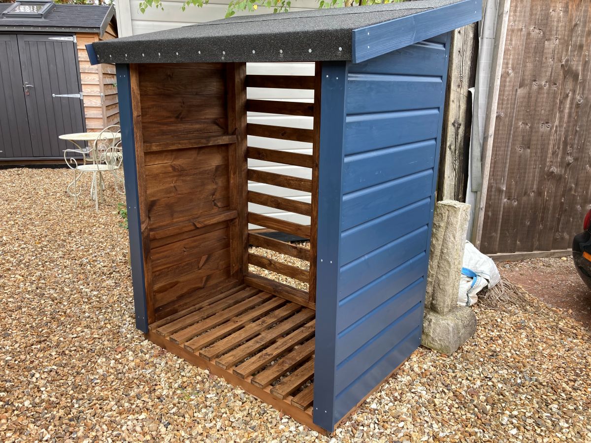 Single Bay Frenchmoor Timber Log Store installed on a brick terrace