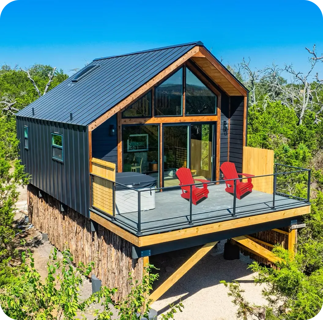 gray concrete building on mountain covered with snow