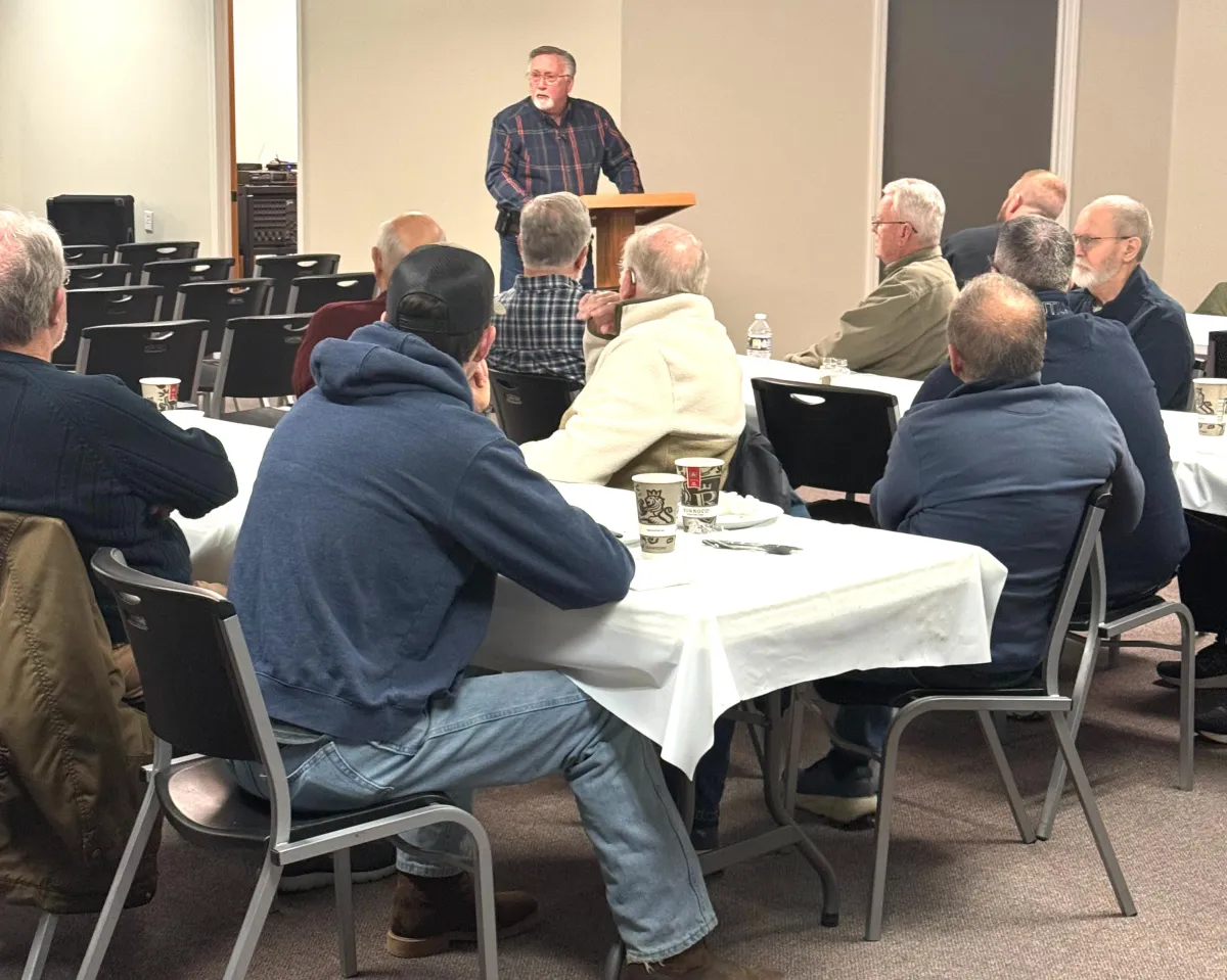 Adults studying the Bible together