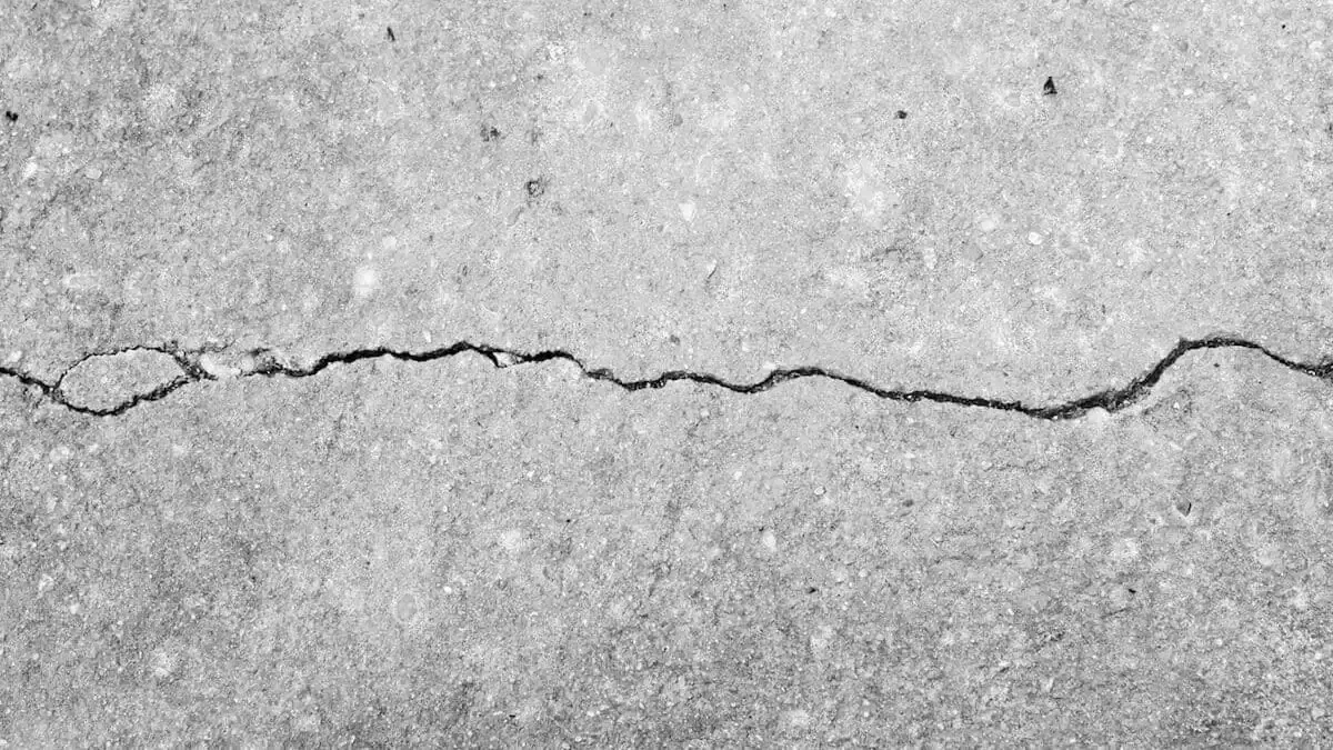 Visible crack in slab foundation caused by shifting soil—often a warning sign of underlying pipe leaks in Hoover.