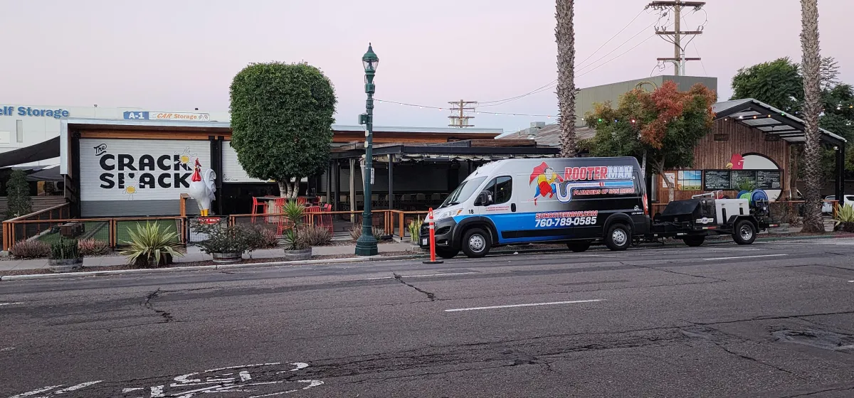 Plumbing van in front of residential home.
