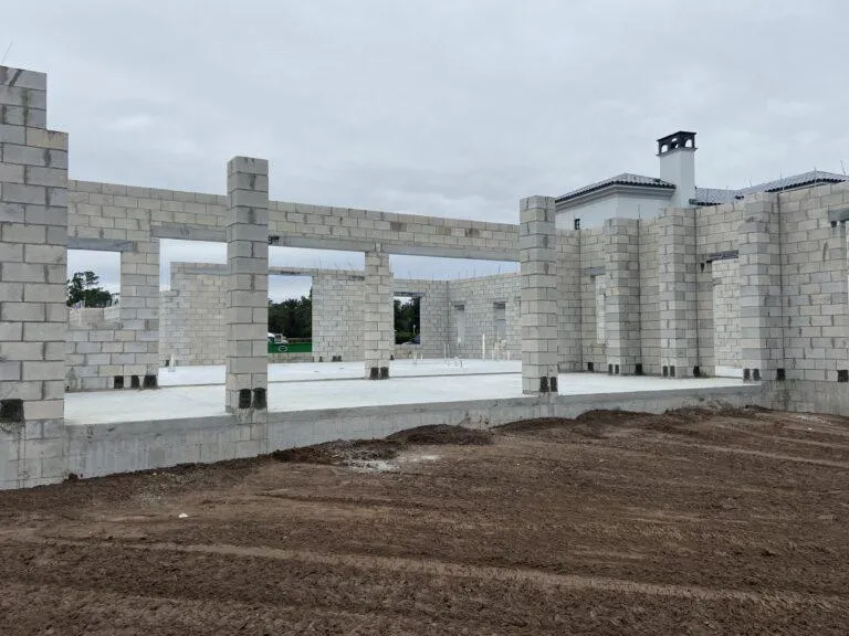 Framing process underway for retractable screen system on residential property during the initial walkthrough