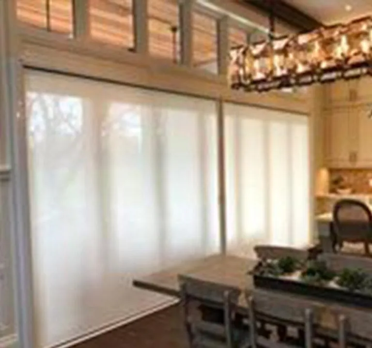 Horizon double solar screens filtering sunlight over large opening