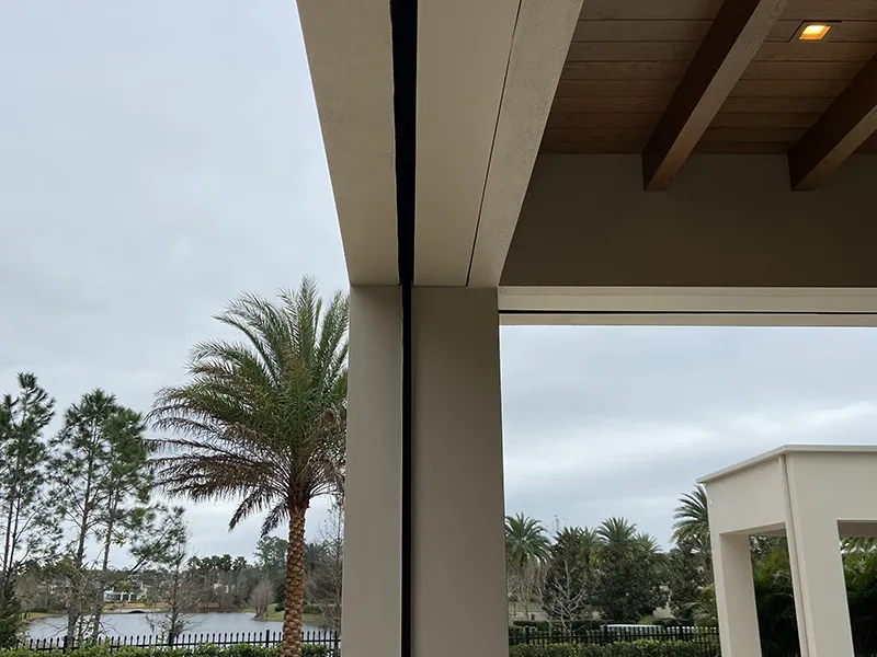 Final screen installation in progress, aligning track and housing for precision fit at the client's residence