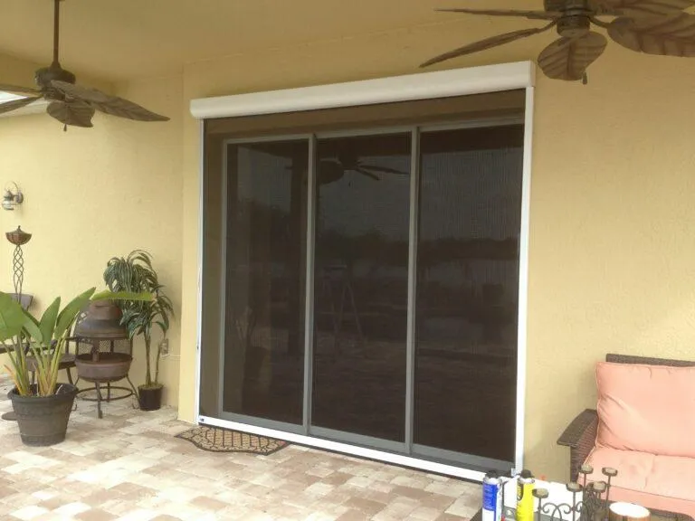 Full-length screen covering sliding door to block bugs while maintaining the view