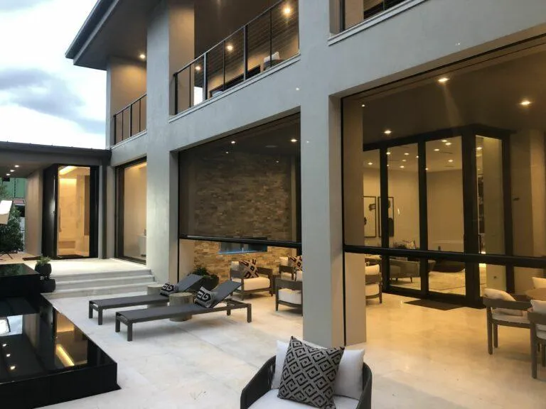 Recessed retractable screen installation blending into architectural framing with clean housing unit mounted above