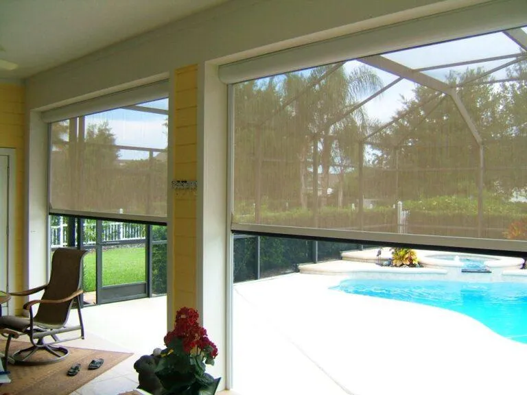 Housed screen unit with integrated solar mesh for sun and insect protection partially extended for controlled sunlight
