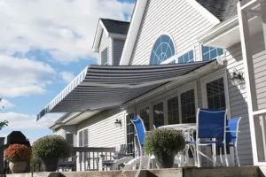Retractable awning shown partially extended with fabric details visible