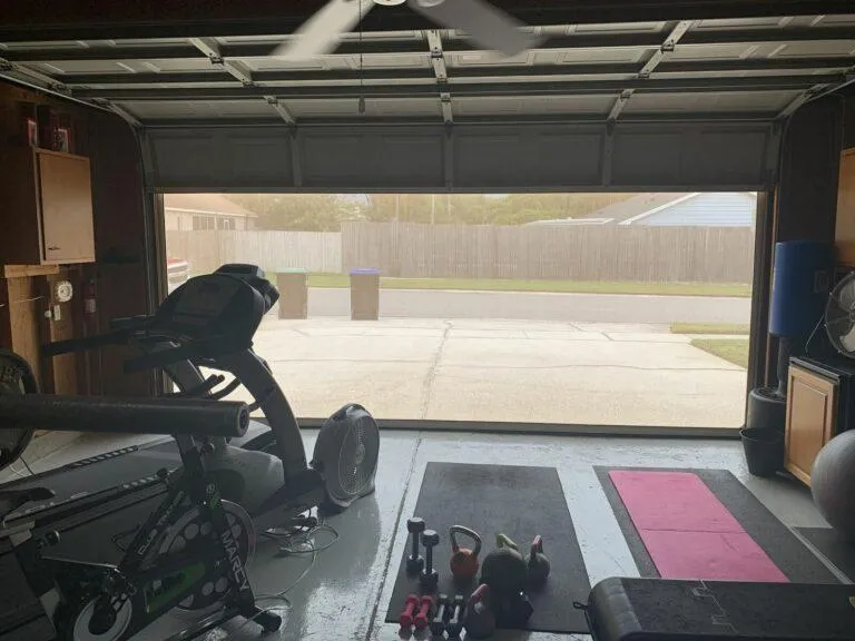 Solar screen system on garage creating privacy and blocking direct sunlight