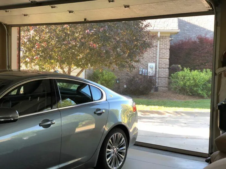 Fully deployed garage screen blocking bugs while letting in fresh air