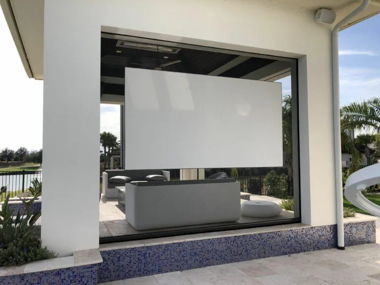 Movie screen system installed outdoors for entertainment from both sides