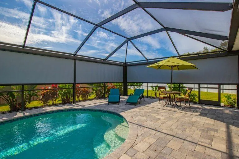 Retractable privacy screen installed for outdoor seclusion and sun control in backyard patio